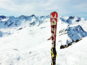 Tourists on snow covered mountain