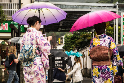 Low angle view of woman standing for sale in market