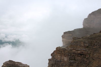 Rock formations on mountain against sky