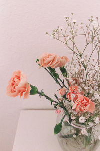 Close-up of rose flower vase on table