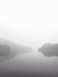 Scenic view of lake during foggy weather