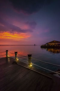 View of swimming pool at sunset