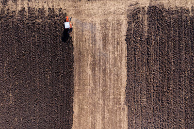 Aerial view of tractor plowing farm