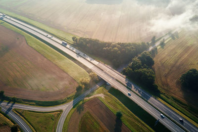 Car traffic on highway at summer day, aerial view