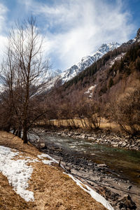 Scenic view of snowcapped mountains against sky