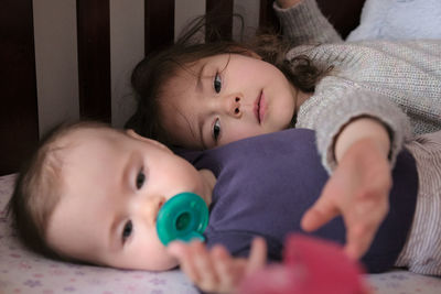 High angle view of cute siblings at home