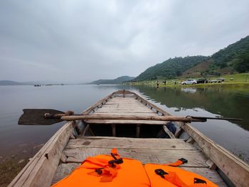Pier over lake against sky