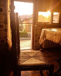 Man standing by window at home