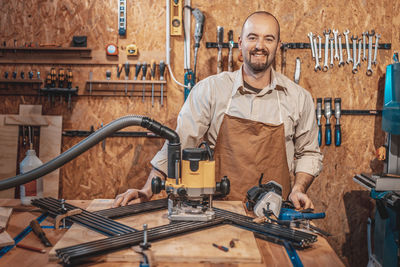 Portrait of young man working at construction site