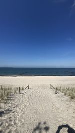 Scenic view of sea against clear blue sky