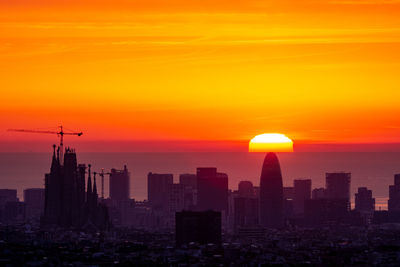 Sunrise behind torre agbar, barcelona