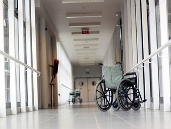 Wheelchair on empty hospital corridor