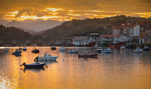 View of boats in lake during sunset