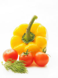 Close-up of red bell peppers on white background