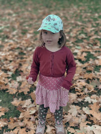 Portrait of girl standing on field