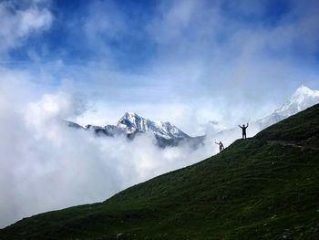 Low angle view of snowcapped mountains against sky