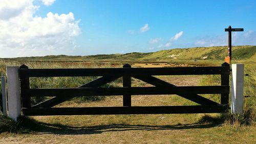 Scenic view of landscape against cloudy sky