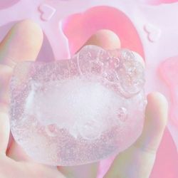 Close-up of hand holding bubbles in water