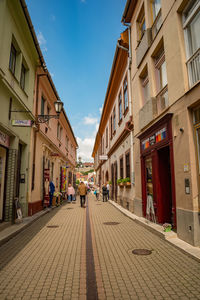 Footpath amidst buildings in town