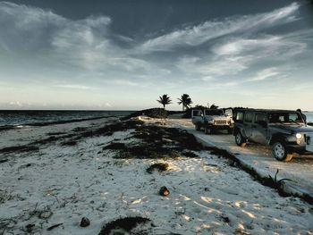 Scenic view of sea against cloudy sky