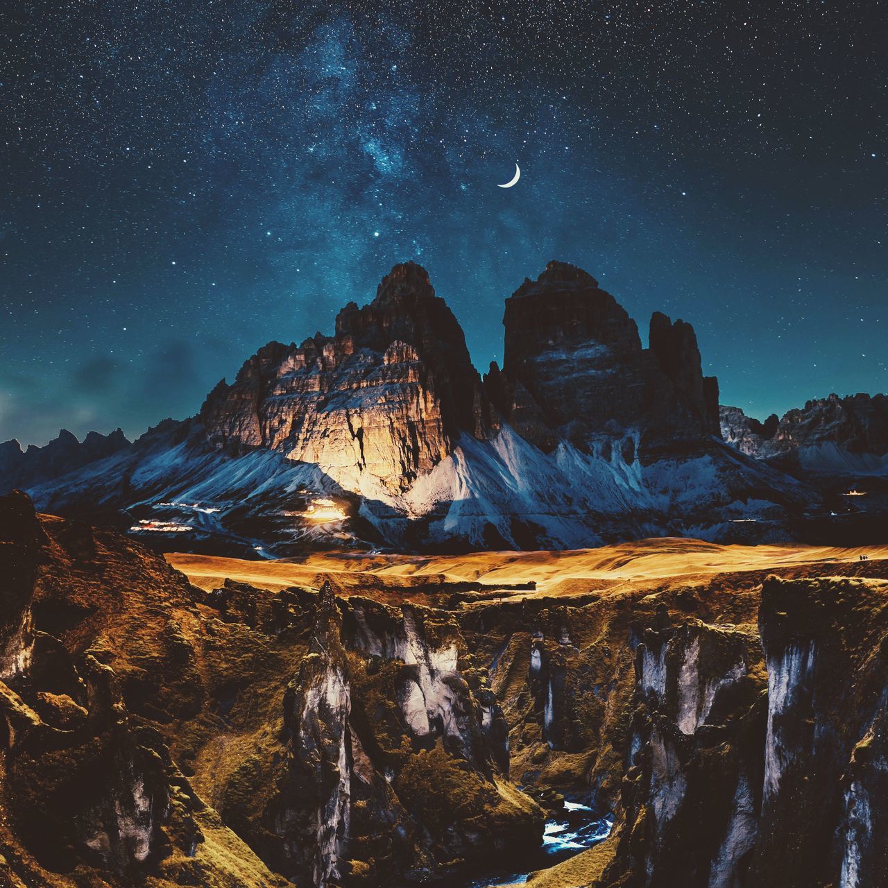 AERIAL VIEW OF ROCK FORMATION AGAINST SKY AT NIGHT