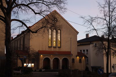 Low angle view of building against sky at dusk