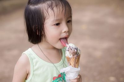 Cute girl eating ice cream