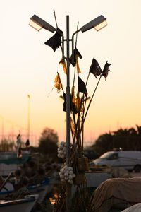 Street light against sky at sunset