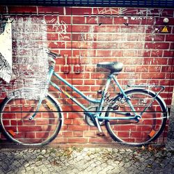 Bicycle against brick wall