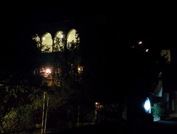 Low angle view of illuminated trees at night