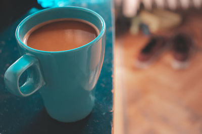 Close-up of coffee cup on table