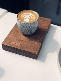 High angle view of coffee cup on table