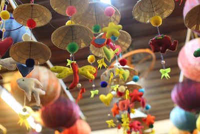 Multi colored lanterns hanging on wall