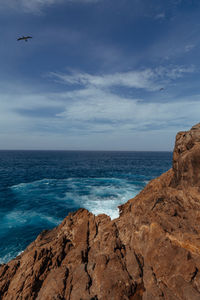 Scenic view of sea against blue sky