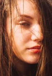 Close-up portrait of woman with brown hair