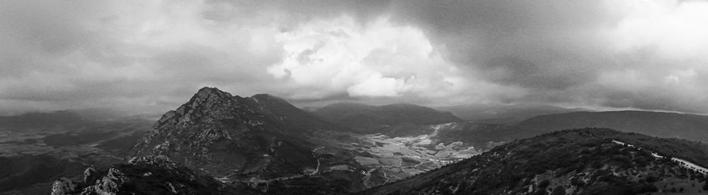 Panoramic view of mountains against sky in bw