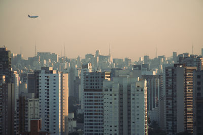 Modern buildings in city against sky