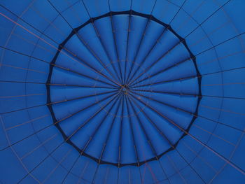 Low angle view of ceiling against clear blue sky