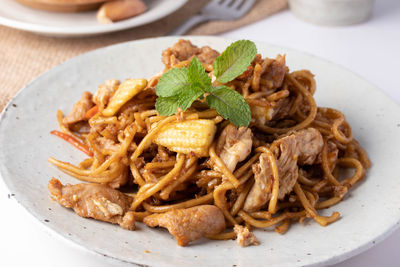 Close-up of noodles served in plate on table