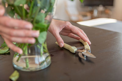 Cropped hand of person working on table