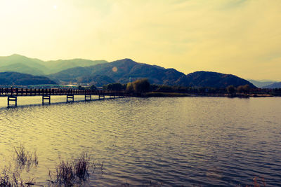 Scenic view of lake against sky during sunset
