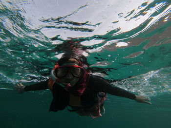 Woman swimming in sea