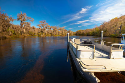 Boats moored in lake