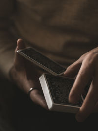 Close-up of hand holding mirror