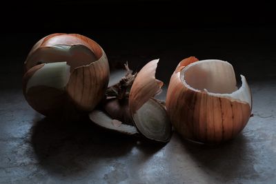 Close-up of fruits on table against black background