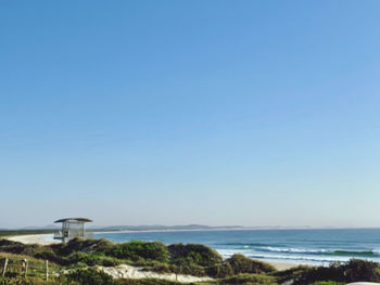 Scenic view of sea against clear blue sky