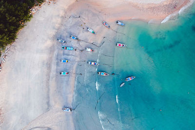 Aerial view of boats moored on beach