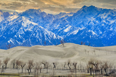 Scenic view of snowcapped mountains against sky