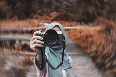 Portrait of man photographing