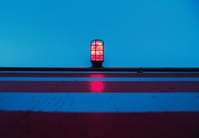 Directly below shot of street light against clear blue sky at dusk